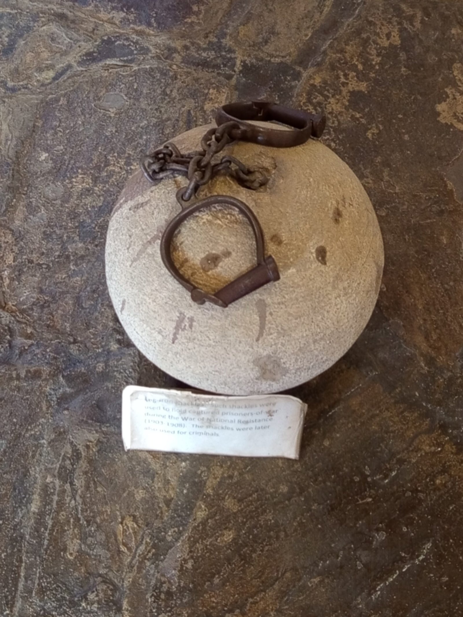 Stone ball with attached leg shackles