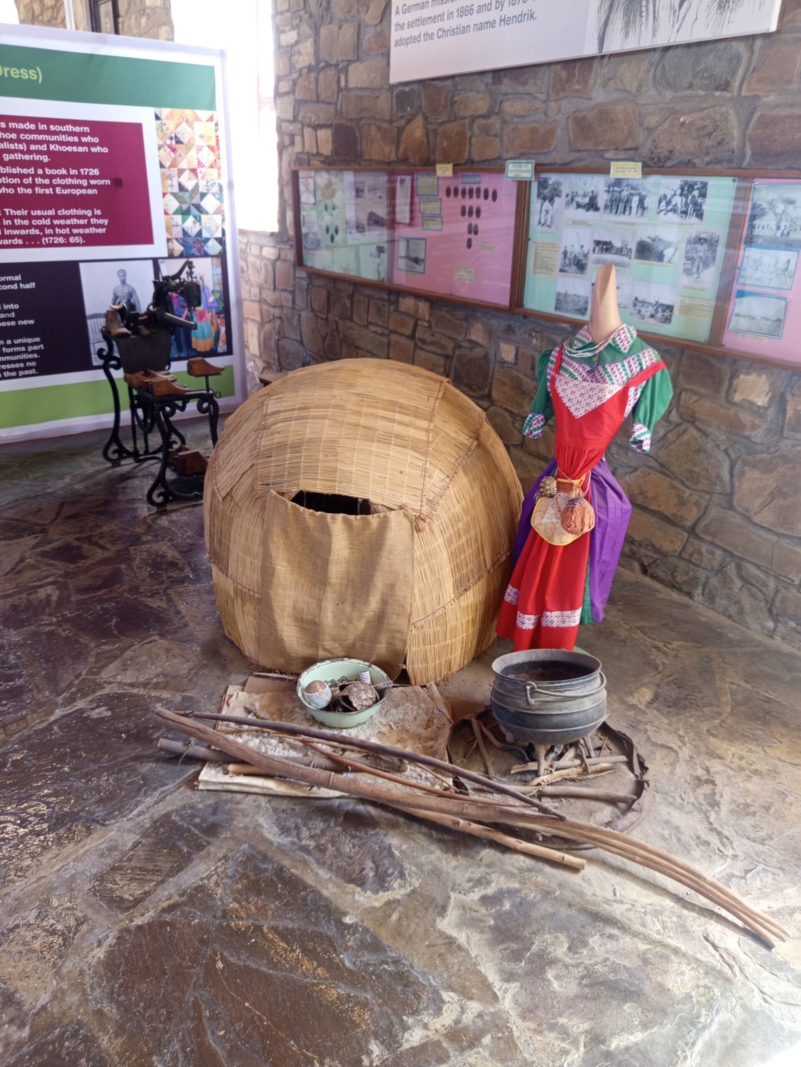 Reconstructed mat house (metjieshuis) and traditional Nama dress next to the mission church